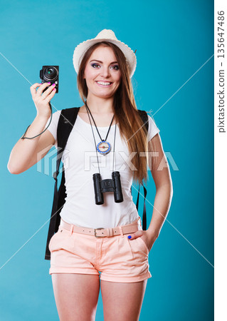 Woman tourist taking photo with camera 135647486
