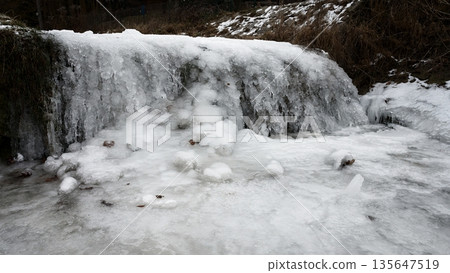 frozen creek. Beautiful winter seasonal  background in nature. 135647519