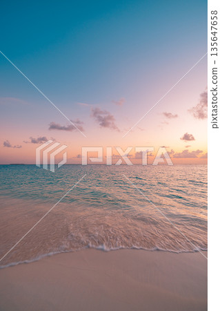 Relaxing beach shore sunset close up ocean waves sand colorful romantic sky vertical wallpaper 135647658