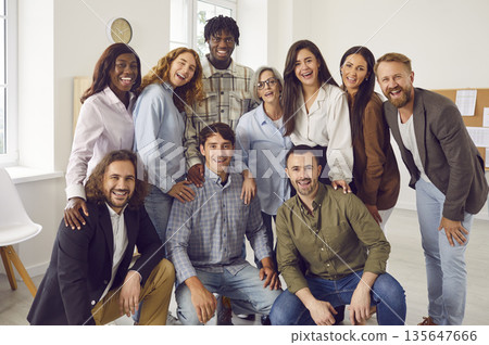 Team of happy smiling diverse business men and women all together at work in the office 135647666