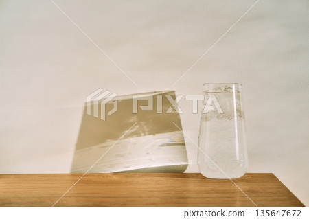 Glass of water with ice getting cool 135647672
