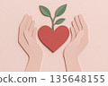Paper cut hand holding heart with sprouting leaf gentle shadow tactile texture pastel pink dusty red natural green palette environment care love growth concept 135648155