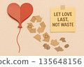 Recycled paper heart balloon deflating into reusable material with sustainable love message on beige background promoting eco friendly relationship and zero waste lifestyle 135648156