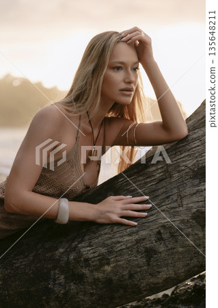 Portrait of beauty blonde woman posing on beach Portrait of beauty blonde woman posing on beach 135648211