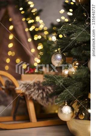 Cozy wooden sleigh with kraft gift and Christmas decorations 135648737