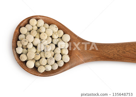 White peppercorns or pepper in wooden spoon isolated on white background. Top view. Flat lay White peppercorns or pepper in wooden spoon isolated on white background. Top view. Flat lay 135648753