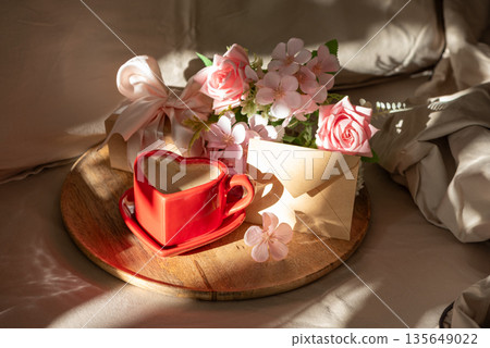 Heart Shaped Coffee Cup with Envelope and Flowers. Romantic Valentines Day Celebration 135649022