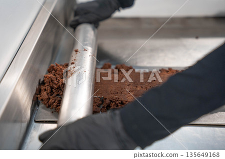 Kneading real chocolate Kneading real chocolate 135649168