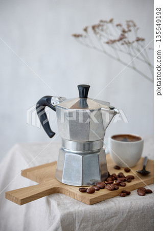 Mocha coffee pot and cup of espresso Mocha coffee pot and cup of espresso 135649198
