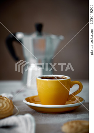 yellow coffee cup and Mocha coffee pot yellow coffee cup and Mocha coffee pot 135649203