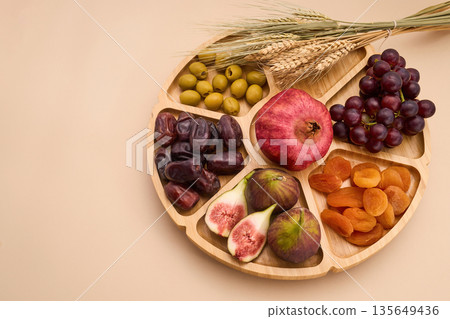 Tu bishvat seder plate with seven species fruits Tu bishvat seder plate with seven species fruits 135649436