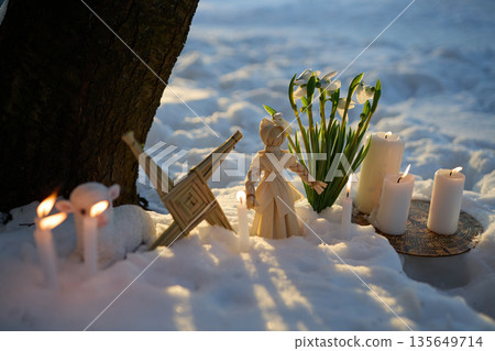 Imbolc pagan ritual with brigid's cross in snow Imbolc pagan ritual with brigid's cross in snow 135649714