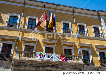 Flags and Banner on Teruel City Hall Facade Flags and Banner on Teruel City Hall Facade 135650919