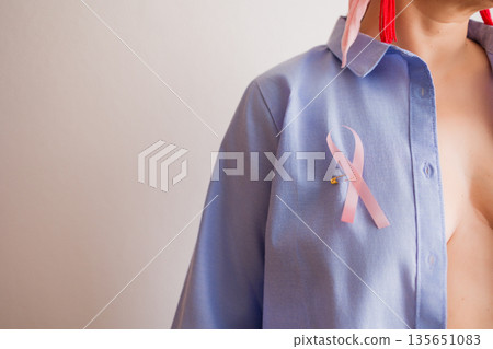 Pink ribbon symbolizing breast cancer awareness month concept Pink ribbon symbolizing breast cancer awareness month concept 135651083