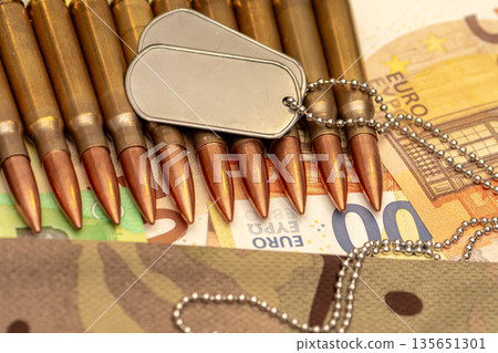 Soldier identification tags placed on ammunition and euro banknotes. Soldier identification tags placed on ammunition and euro banknotes. 135651301