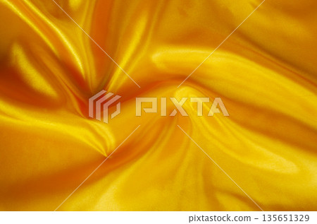 Neutral silk fabric texture with soft flowing folds creating a clean and elegant abstract background. Neutral silk fabric texture with soft flowing folds creating a clean and elegant abstract background. 135651329