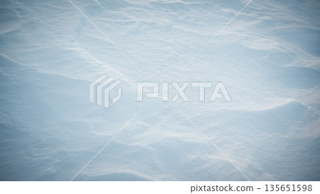 Frozen textured snow surface illuminated by soft natural light 135651598