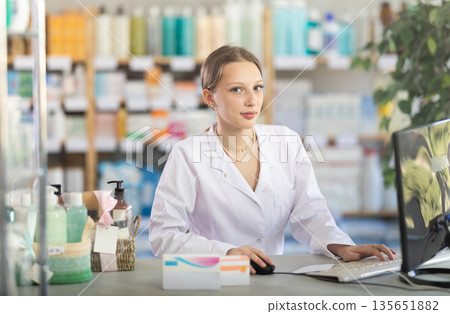 Young Pharmacist Standing Near Computer Young Pharmacist Standing Near Computer 135651882