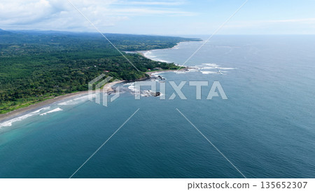 Costa rica pacific coastline with lush rainforest and crashing waves Costa rica pacific coastline with lush rainforest and crashing waves 135652307