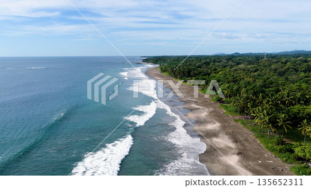 Costa rica pacific ocean coastline with waves breaking Costa rica pacific ocean coastline with waves breaking 135652311