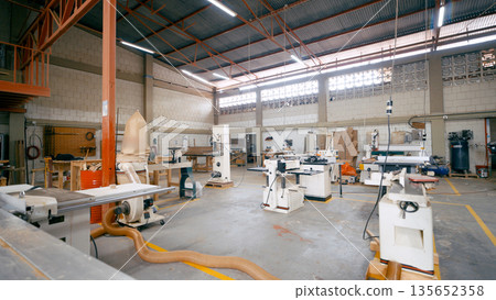 Woodworking workshop with industrial machinery for carpentry 135652358
