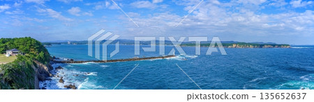 A panoramic view of the coastline with blue sea and sky seen from Anorisaki Lighthouse. A stunning travel destination A panoramic view of the coastline with blue sea and sky seen from Anorisaki Lighthouse. A stunning travel destination 135652637
