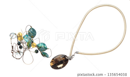 Silver wire jewel bead style necklet fly in air. Jewelry bead necklace as gemstone for fashion ornament decorative items. Fashion ornament necklace to add more style. White background isolated Silver wire jewel bead style necklet fly in air. Jewelry bead necklace as gemstone for fashion ornament decorative items. Fashion ornament necklace to add more style. White background isolated 135654038