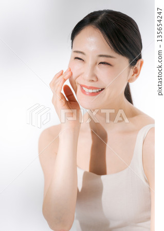 A young lady hitting his cheek A young lady hitting his cheek 135654247