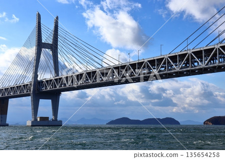 The Seto Ohashi Bridge and a running train (Seto Ohashi Line) 135654258
