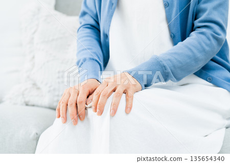 Senior woman with elbow pain Senior woman with elbow pain 135654340