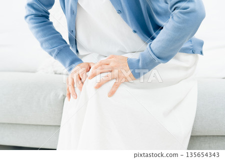 Senior woman with elbow pain Senior woman with elbow pain 135654343