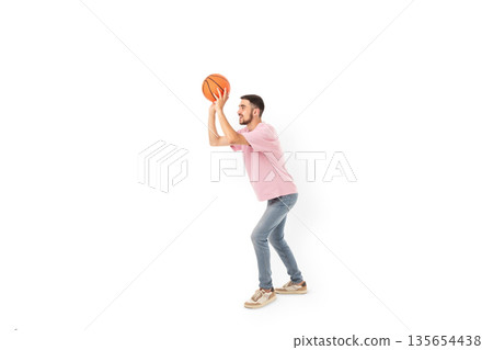 Athlete gets ready to make a basketball shot, isolated, PNG 135654438