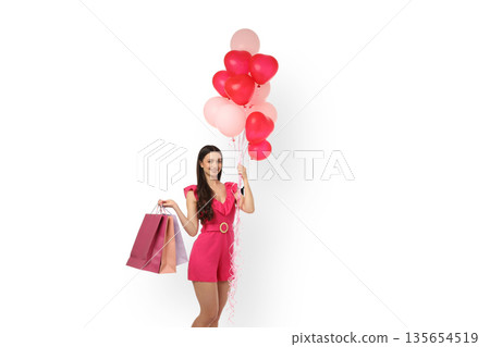 Woman in pink outfit holding shopping bags and balloons, isolated, PNG Woman in pink outfit holding shopping bags and balloons, isolated, PNG 135654519