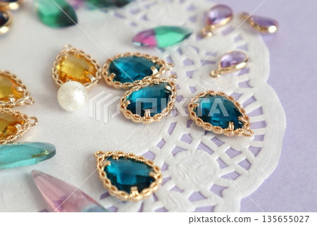 Colorful glass beads, cotton pearls and lace paper Colorful glass beads, cotton pearls and lace paper 135655027