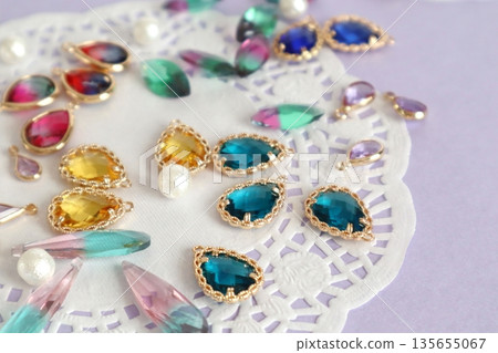 Colorful glass beads, cotton pearls and lace paper Colorful glass beads, cotton pearls and lace paper 135655067