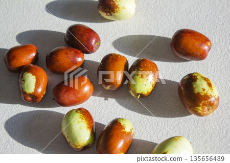 These are dates that are ripening red. 135656489