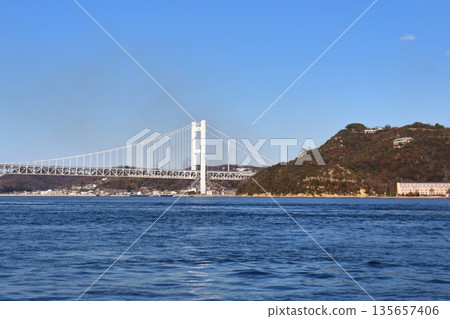 The Seto Ohashi Bridge and Washuyama Observatory seen from offshore Hitsuishijima The Seto Ohashi Bridge and Washuyama Observatory seen from offshore Hitsuishijima 135657406