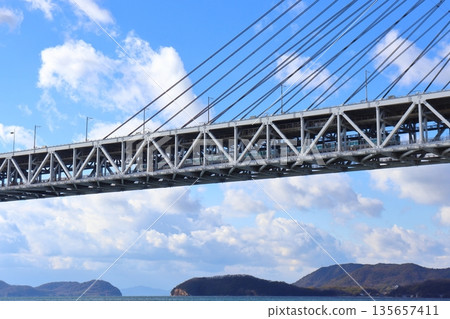 A train running under the Seto Ohashi Bridge (Seto Ohashi Line) A train running under the Seto Ohashi Bridge (Seto Ohashi Line) 135657411