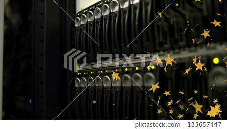 Displaying server rack drive bays in data center, with glowing LEDs and golden star overlays 135657447