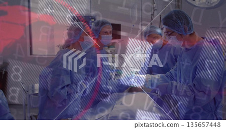 Performing surgery team wearing gowns using instruments in operating room, viewing vitals monitor 135657448