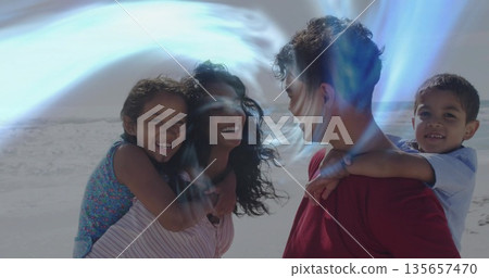 Parents wearing red shirt and striped top carrying children piggyback on beach, bright reflections Parents wearing red shirt and striped top carrying children piggyback on beach, bright reflections 135657470