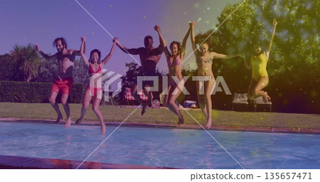 Jumping group of six friends holding hands at backyard pool, with swimsuits and inflatable ball Jumping group of six friends holding hands at backyard pool, with swimsuits and inflatable ball 135657471