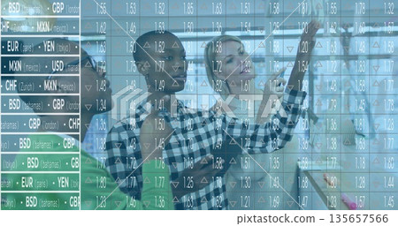 Gesturing professionals in suits analyzing currency rates with arrows on glass wall in office 135657566