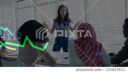 Presenting team lead using gestures in conference room, with windows, papers and chart overlay 135657611