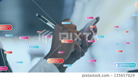 Woman wearing white shirt holding smartphone and stylus in office, with digital tags and icons Woman wearing white shirt holding smartphone and stylus in office, with digital tags and icons 135657829