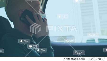 Talking masked commuter holding phone while gazing out car window, with callout icons, copy space Talking masked commuter holding phone while gazing out car window, with callout icons, copy space 135657833