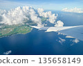 Landscape photos of the Okinawan sea and islands taken from inside the plane 135658149
