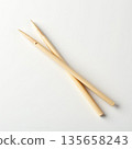 Natural Wooden Chopsticks on Clean White Surface for Culinary Use 135658243