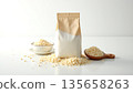 Minimalist White Package of Grain with Loose Rice on Table 135658263