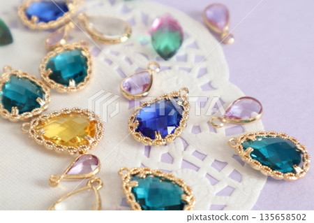 Colorful beads, blue glass beads and lace paper 135658502